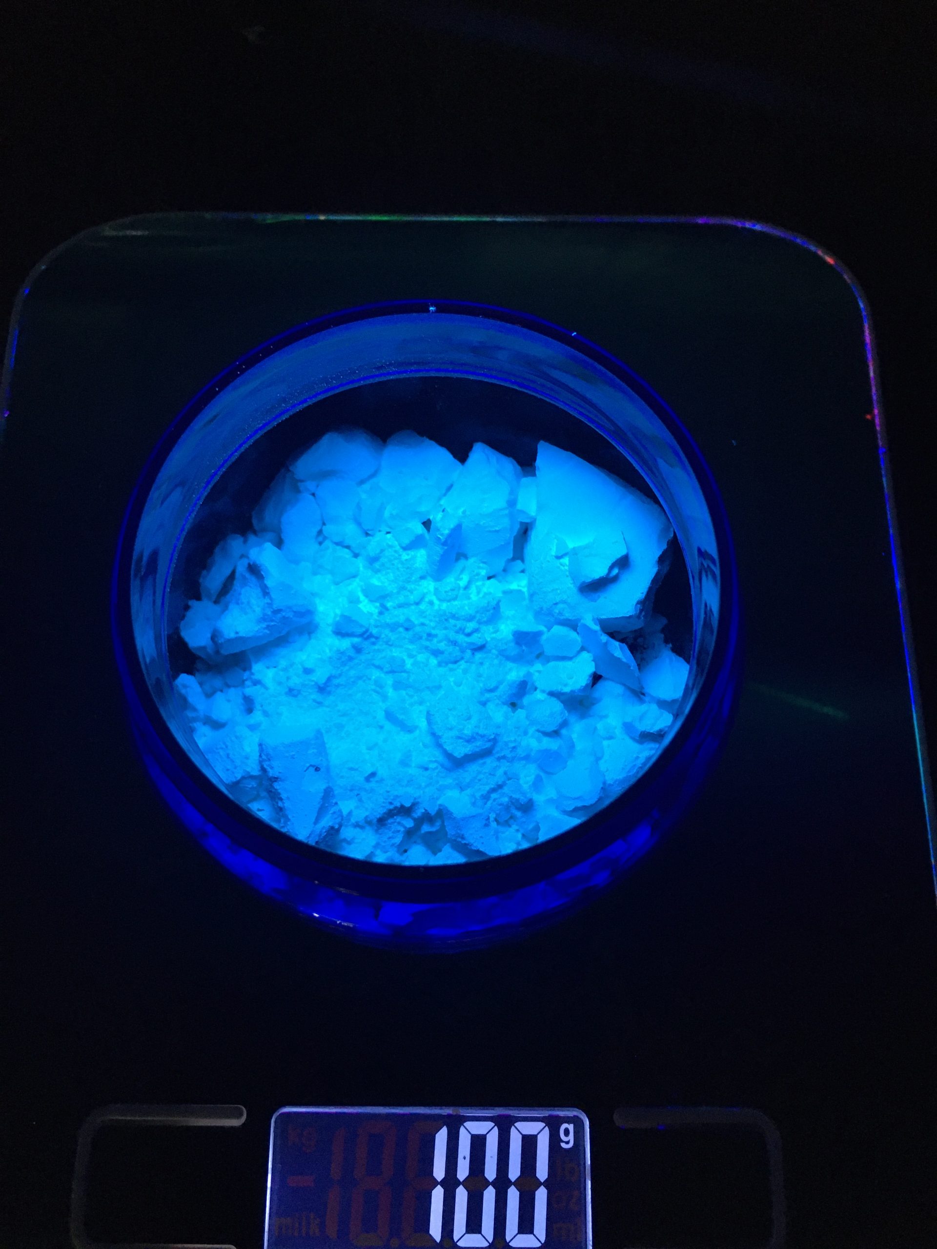 Example of 100 grams blue phosphor under UV light