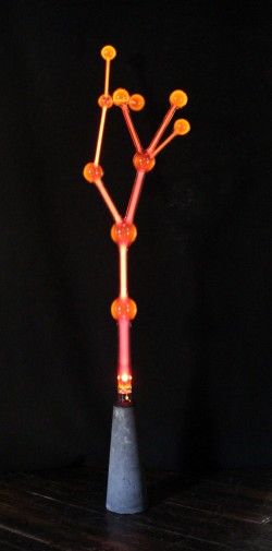 Flameworked borosilicate glass, inert gas, electricity, concrete base
24"w x 24"d x 84"h Wayne Strattman lighted glass plasma sculpture