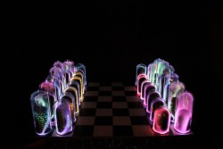Flameworked borosilicate glass, phosphors, inert gas, electricity, capacitive chess board
36"w x 36"d x 15"h plasma light art wayne strattman