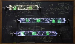 Flameworked borosilicate glass tubes, sandblasted etched glass with photo transfer, inert gas, phosphors, electricity
48"w x 5"d x 36"h plasma light art wayne strattman